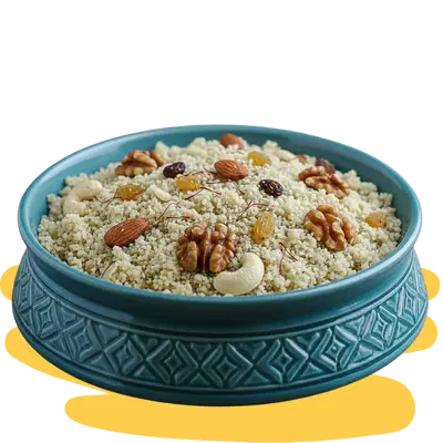 A dark blue bowl containing Lite Panjeeri, featuring large white lotus seeds (makhana),alomods, and a variety of nuts